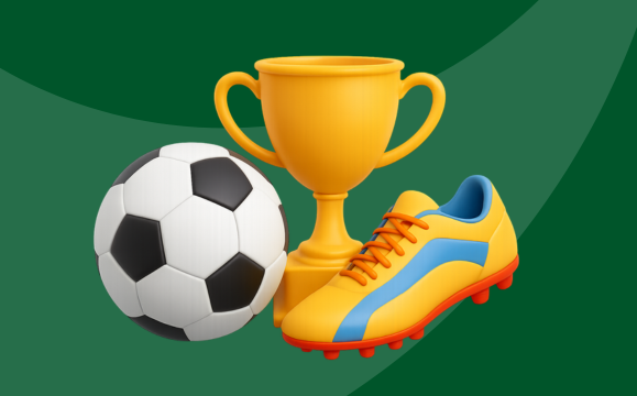 Un balón de fútbol, un trofeo y unas botas de fútbol